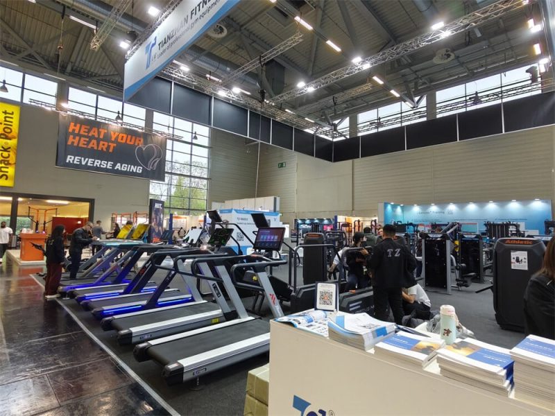 TZ Exhibitions 14 Visitors testing advanced cardio fitness equipment during the FIBO 2025 exhibition in Cologne.